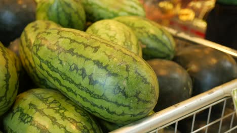 watermelons in a grocery store basket