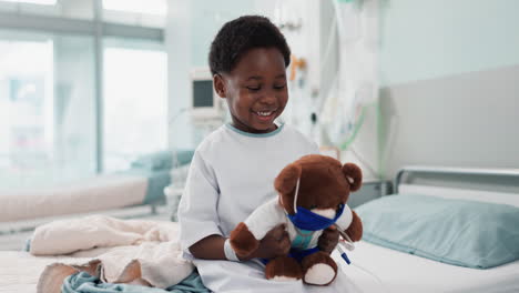 healthcare, black child and teddy bear in hospital