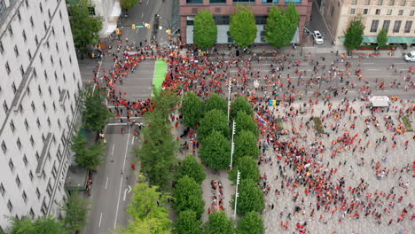 Protesters-Gather-in-the-Streets-of-Vancouver-to-Cancel-Canada-Day,-Drone-overhead-view-moving-forward-in-UHD