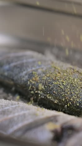 prepares food in the kitchen. close up of fish preparing in the kitchen