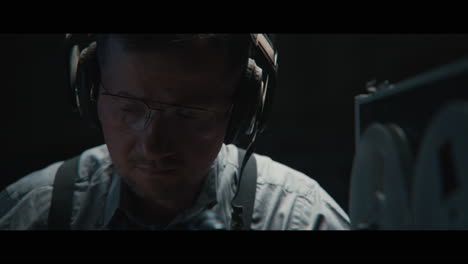 an intelligence officer listens to the wiretap recordings