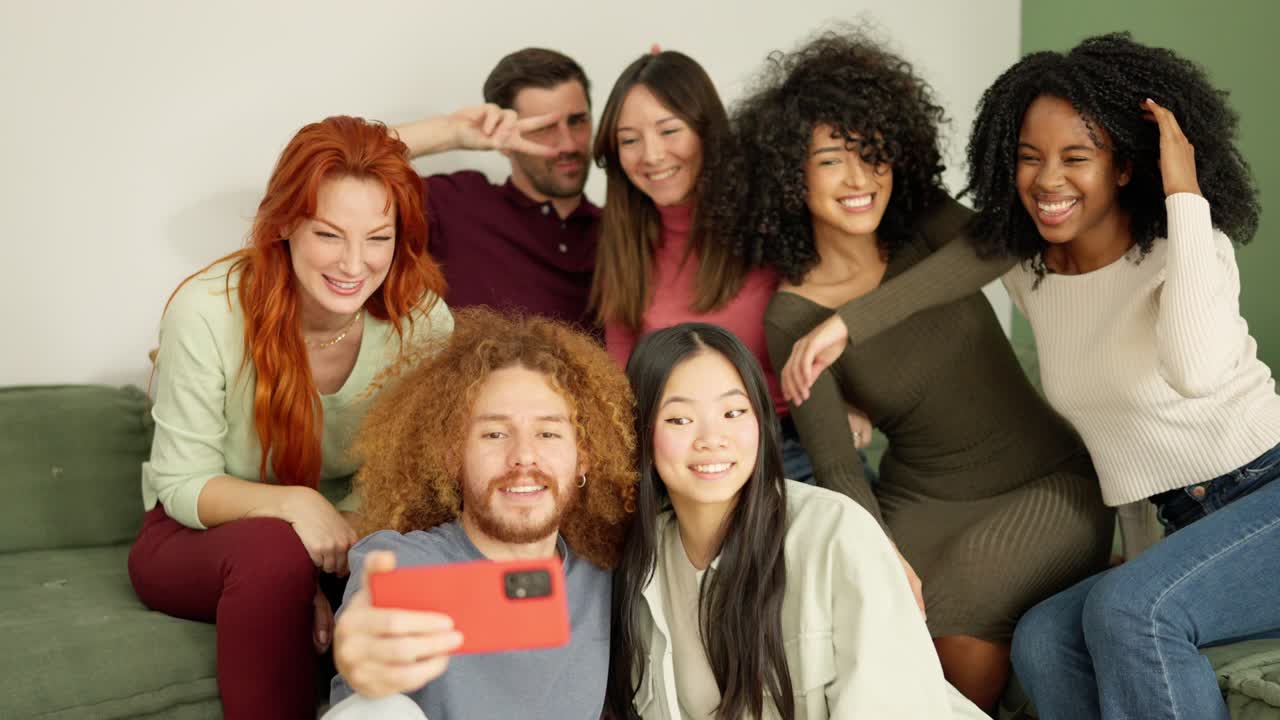 Multi-ethnic friends taking a selfie at home