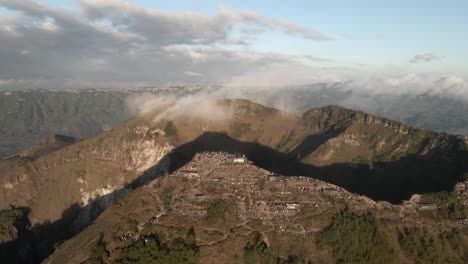 cloud drifts across summit crater, tourists on mount batur volcano