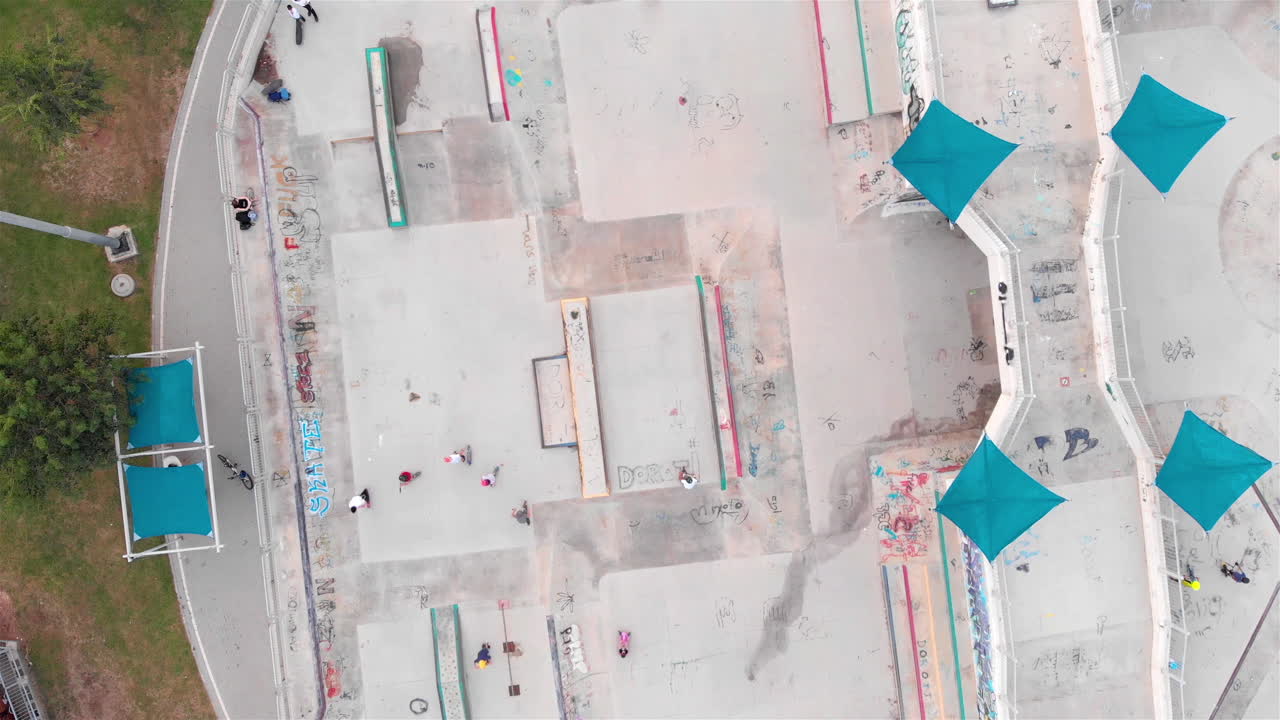 Drone footage Above Skatepark with People Skating