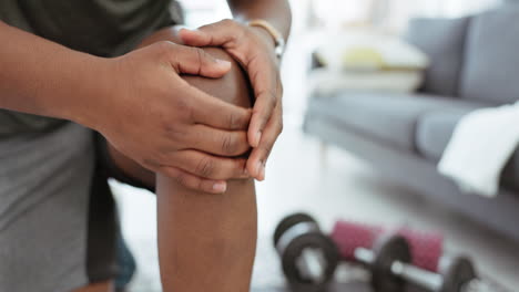 hands, health and black man with knee pain in home