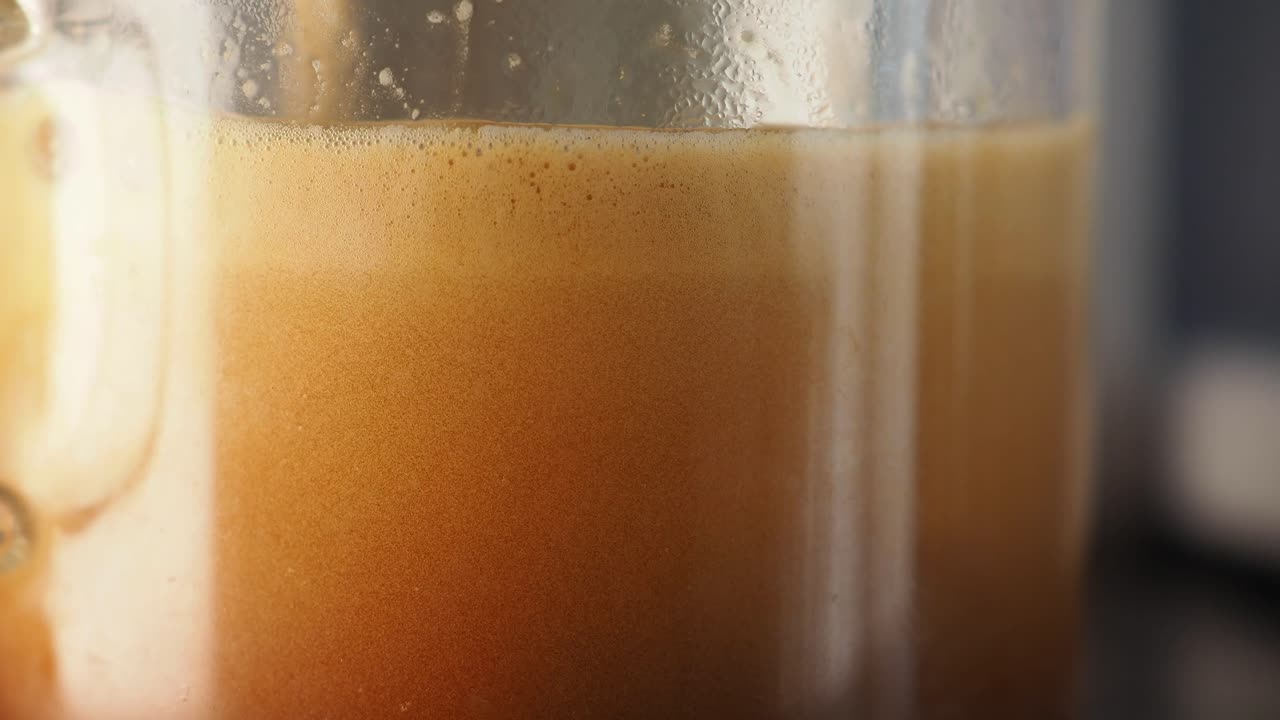 Close-up of a coffee beverage with rich crema