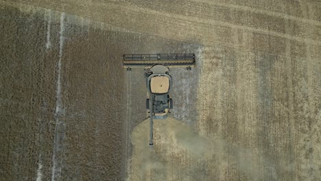 Overhead-Shot-Of-Tractor-Harvesting-Wheat,-Grain-Harvest-Industry,-Esperance-Area,-Western-Australia