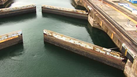 hydraulic gates slowly opening at gatun locks, panama canal