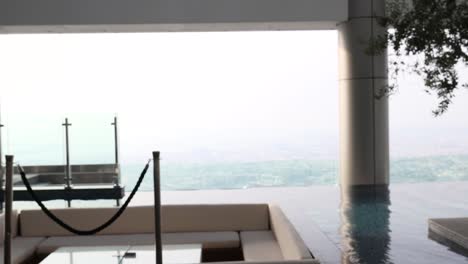 beer glass by infinity pool with scenic view