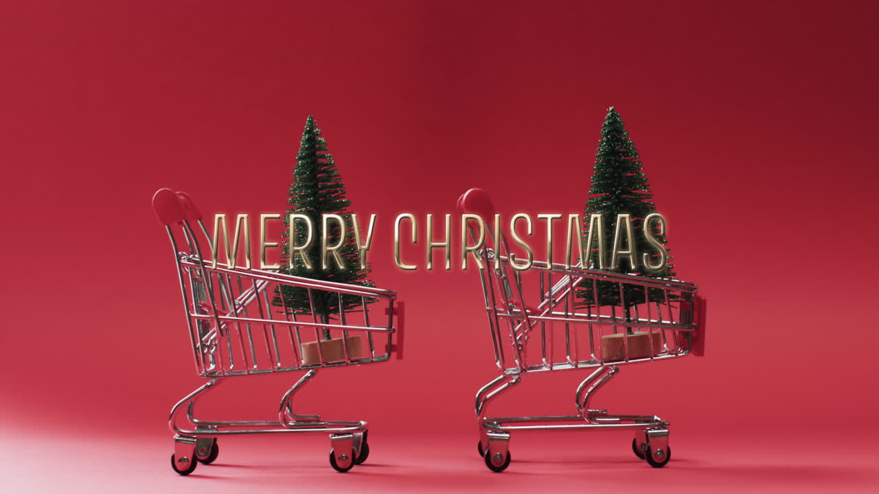 Merry christmas text in gold over christmas trees in shopping carts on red background