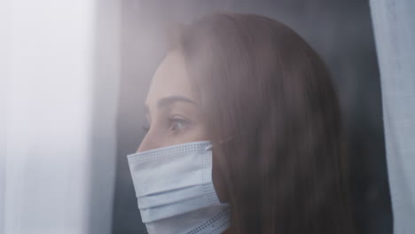 a young woman wearing a mask