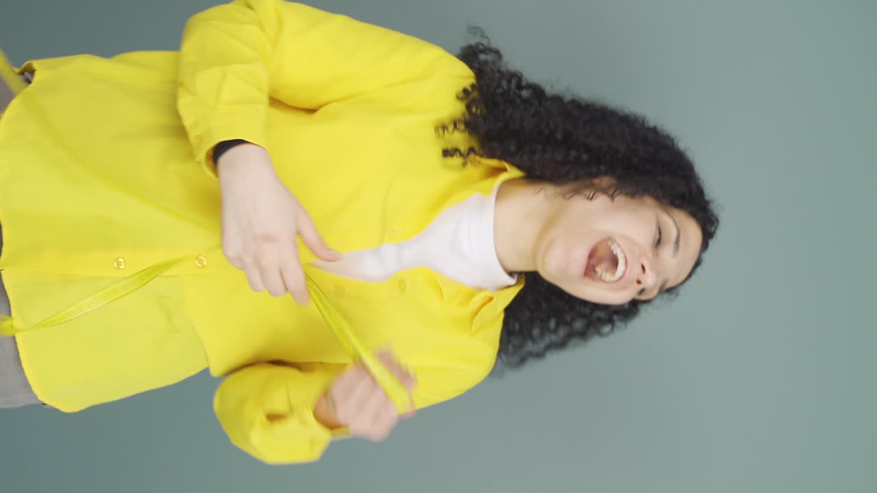 Vertical video of The young woman who is satisfied with her weight.