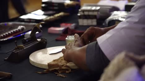 hand rolling a cigar at event