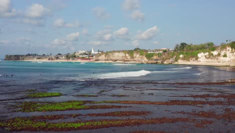 The-surf-spot-of-Bingin-at-the-cliffs-of-Uluwatu-during-a-sunny-day