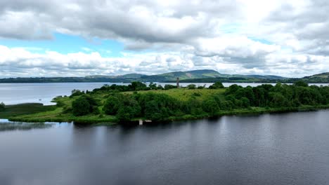 Ireland-Epic-Locations-drone-flying-over-the-Shannon-River-at-Lough-Derg-to-The-early-Christian-site-preserved-on-the-island-dramatic-landscape