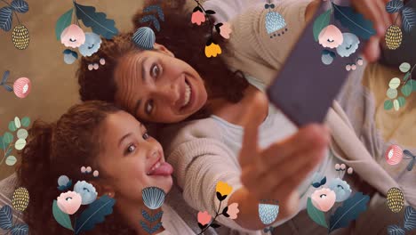 Animación-De-Flores-Coloridas-Sobre-Madre-E-Hija-Haciendo-Muecas,-Tomándose-Selfies-Con-Un-Teléfono-Inteligente