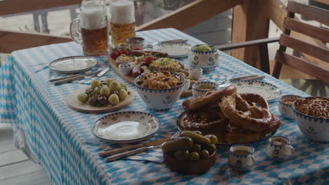 oktoberfest table with beer and traditional german food