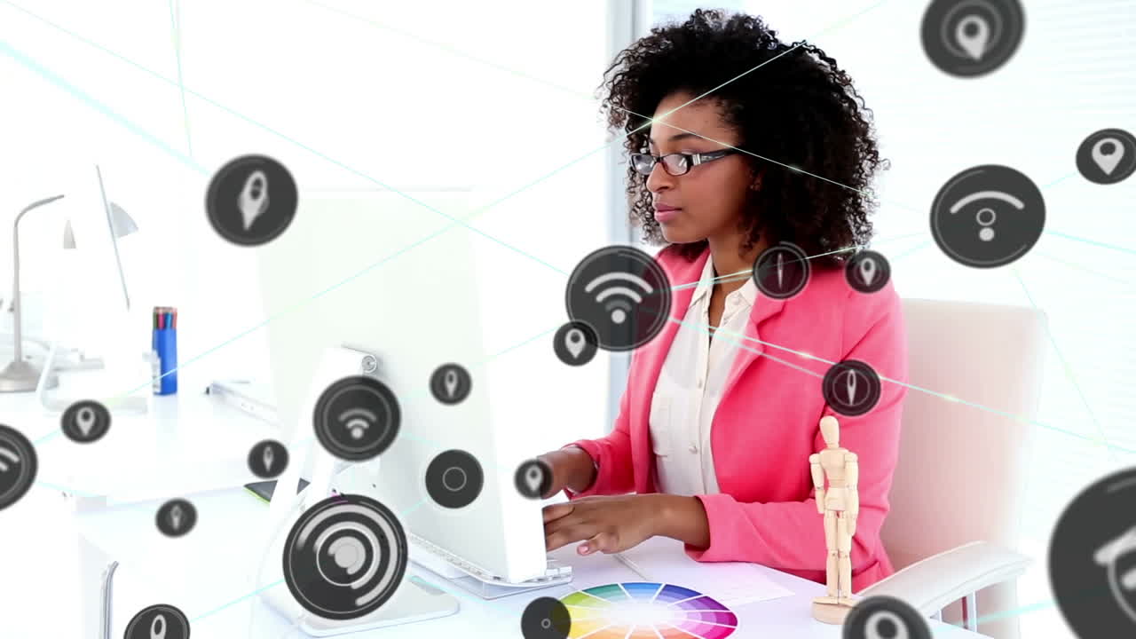 Animation of network of digital icons over happy african american woman using computer at office