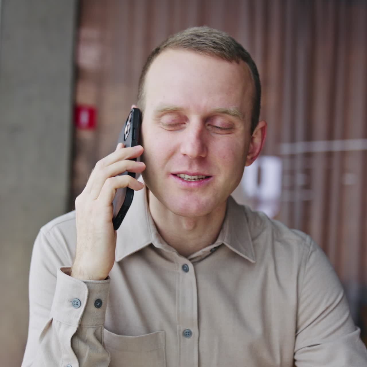 Amazed happy businessman receiving reading good news. Office workerworking with phone
