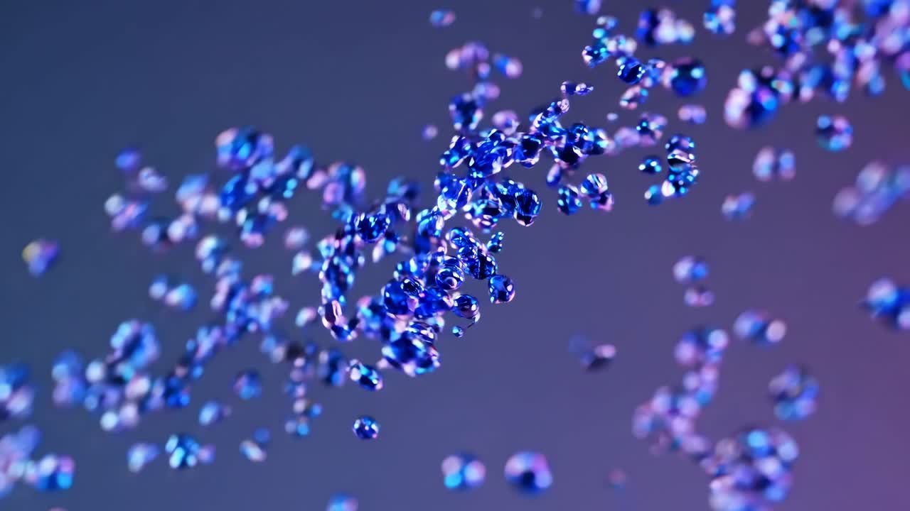 Dynamic video of shimmering blue particles in motion, captured from a close-up angle