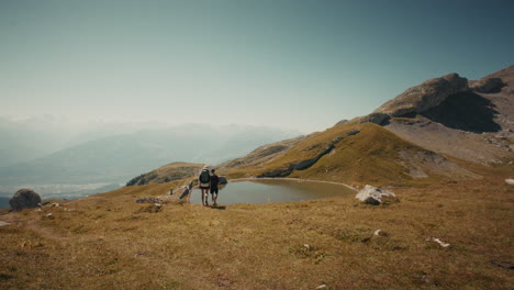 hikers enjoying a scenic mountain lake view in the alps