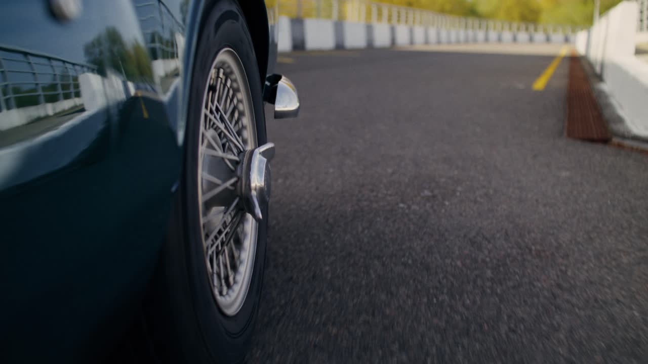 Vintage Green Car on a Racing Track