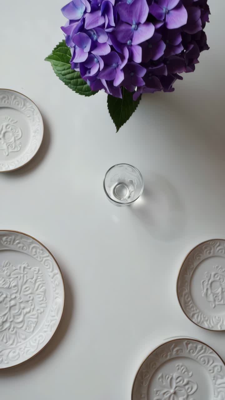 Elegant Table Setting with Purple Hydrangeas and White Plates
