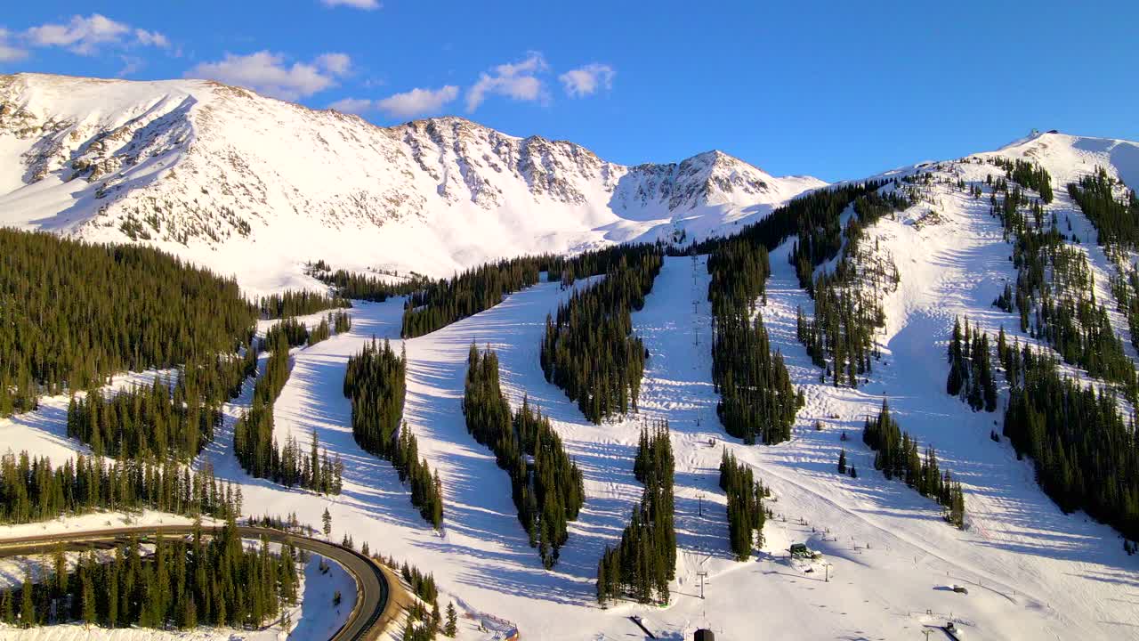 Flying over Alpine ski resort in Summit County, Rocky mountains.
