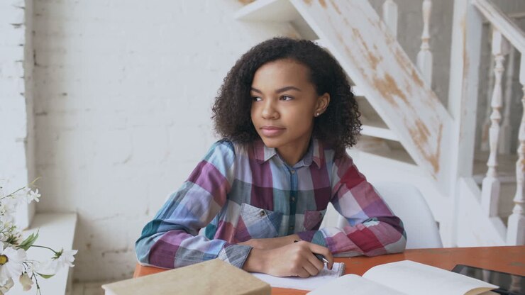 Teenage girl studying at home