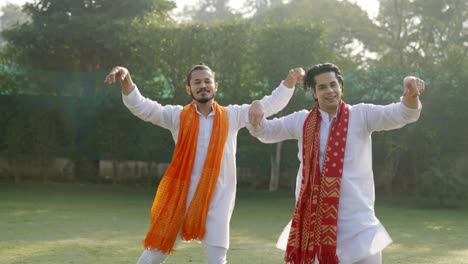 indian men doing bhangra dance