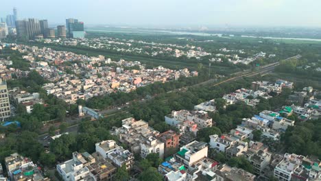 noida city and drone moving closer to yamuna river bird eye view in noida delhi in india