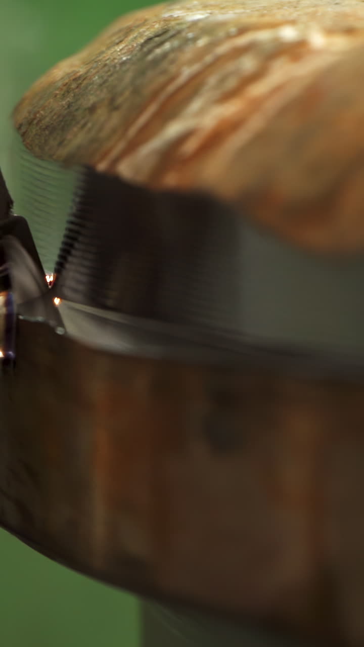 Close-up view of a grooved disc during a grinding or polishing process