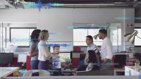 animation of data processing against team of diverse colleagues discussing together at office