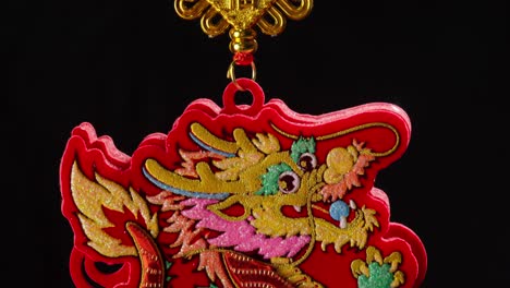 close shot of a dragon pendant, chinese new year decoration, isolated background