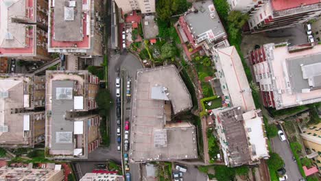 Cityscape-of-Genoa-with-streets-and-vehicles-in-top-down-aerial-view