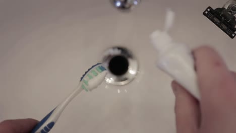 toothpaste layered on a toothbrush