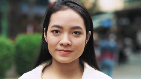 handheld video shows of young vietnamese woman looking at camera