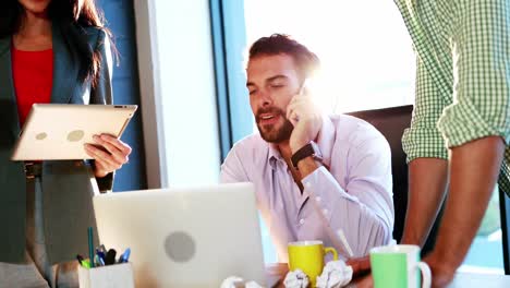 Businessman-talking-on-mobile-phone