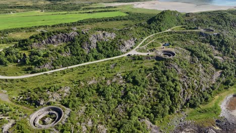 aerial footage of batterie dietl on engeløya, norway. a historic world war ii site now set on a peaceful island, surrounded by mountains and lapped by the sea