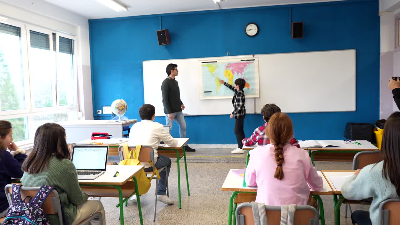 Classroom lesson with teacher and students