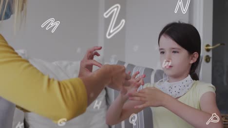 Animation-of-letters-over-caucasian-woman-and-her-daughter-wearing-face-masks-using-sign-language