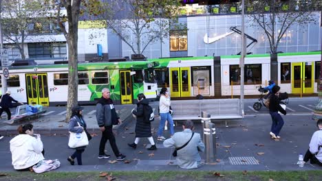 pedestrians and tram in melbourne city street