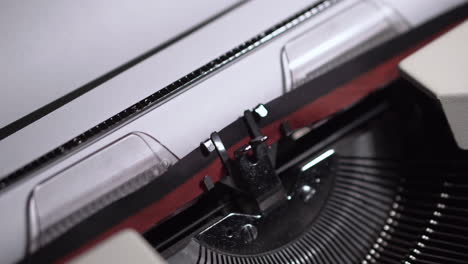 episode 7, typing on white paper in vintage typewriter, writing script or novel, close up