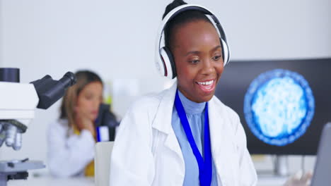 Black-woman,-listening-to-music-with-scientist