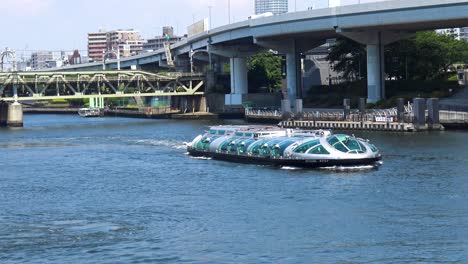 Tourist-Boat-on-the-river-in-Asakusa,-Tokyo-Japan