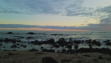 Empty-rocky-beach-during-sunset