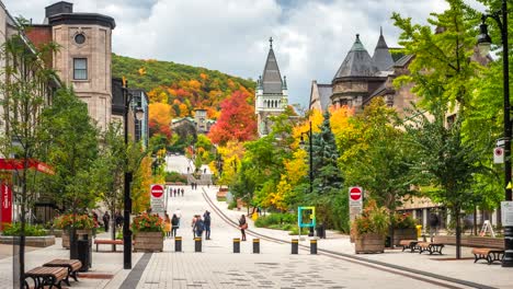 montreal, quebec, canada, time lapse view of historic landmark mcgill university and people walking on mctavish street by day in autumn season