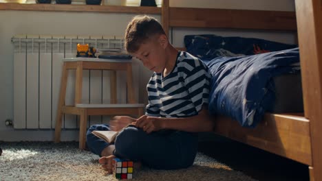 boy reading in his bedroom
