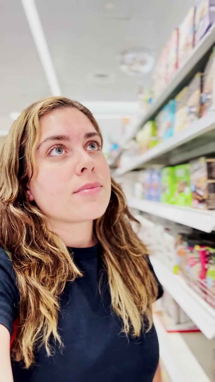 Thoughtful Woman in a Brightly Lit Store Aisle