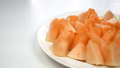 exotic melon fruit close-up. sliced melon on a white background